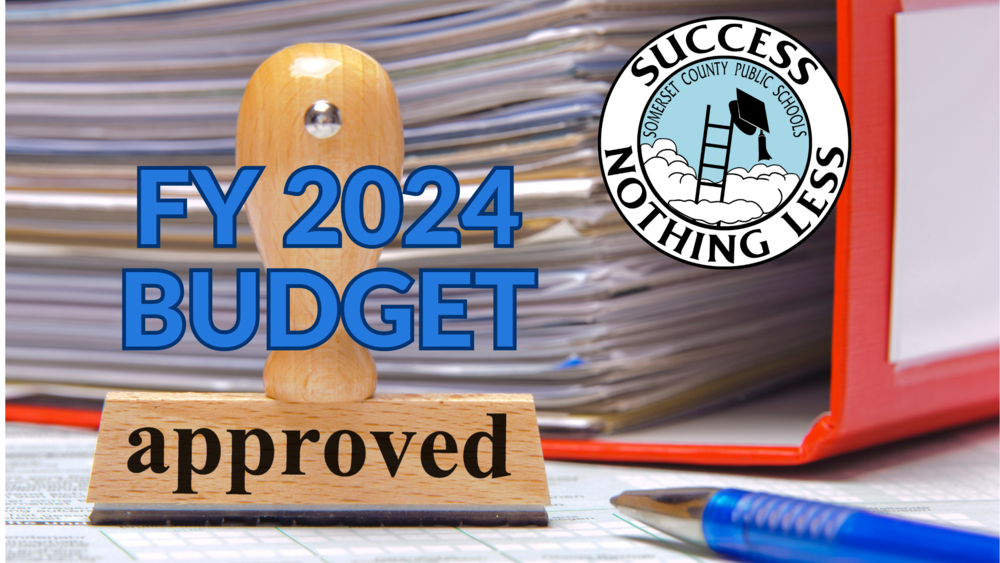 BINDER with rubber stamp on desk that says approved and text that reads fy2024 budget and the scps logo
