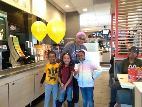 woman and three students