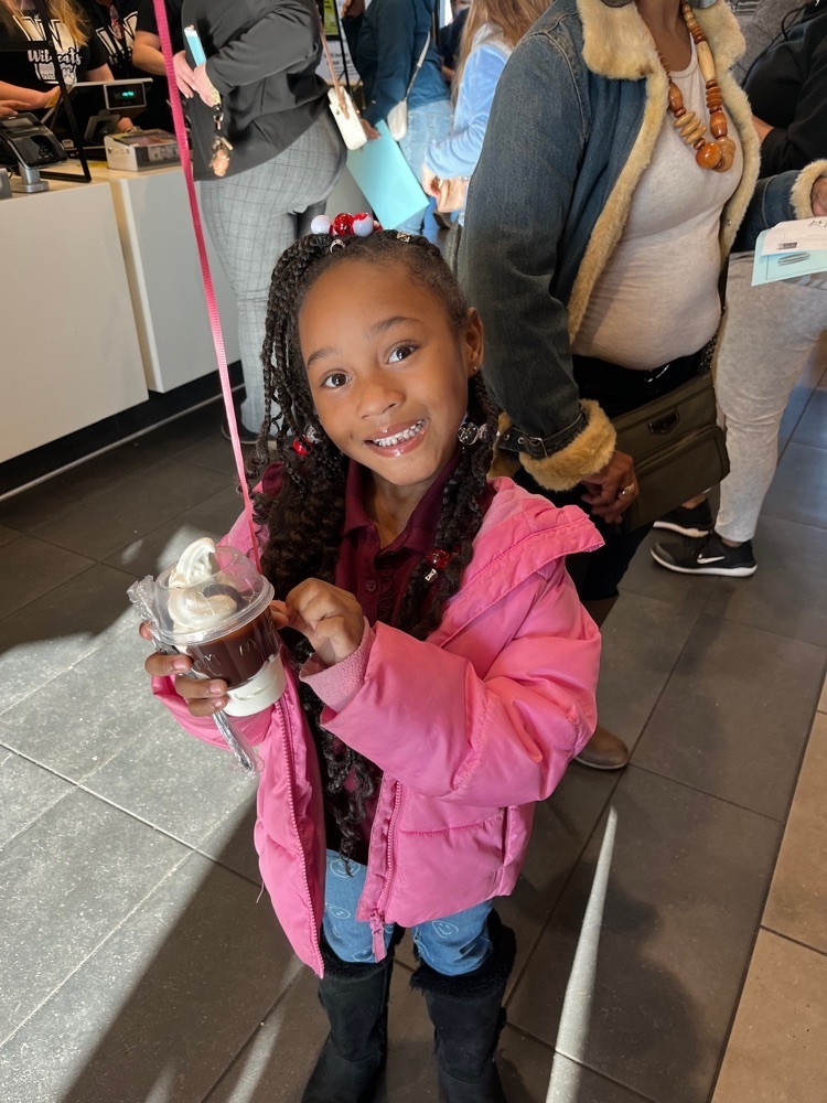 girl smiling holding ice cream