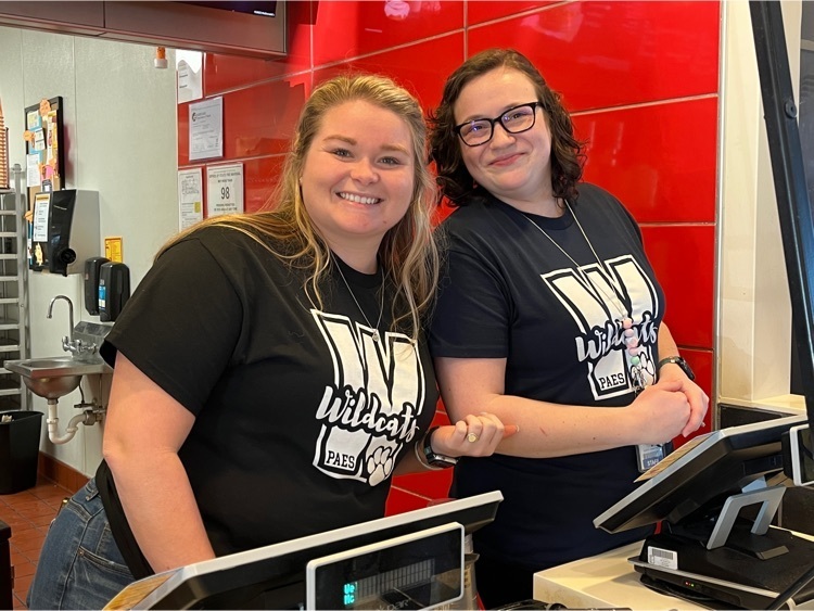 two women behind cash register 